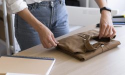 close-up-hands-folding-clothing-item