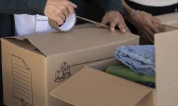 close-up-volunteer-oganizing-stuff-donation